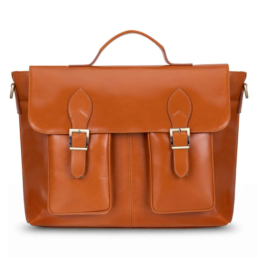 A cognac brown leather briefcase with a top handle, two front flap pockets with gold-tone buckle details, and a shoulder strap, shown against a plain white background.