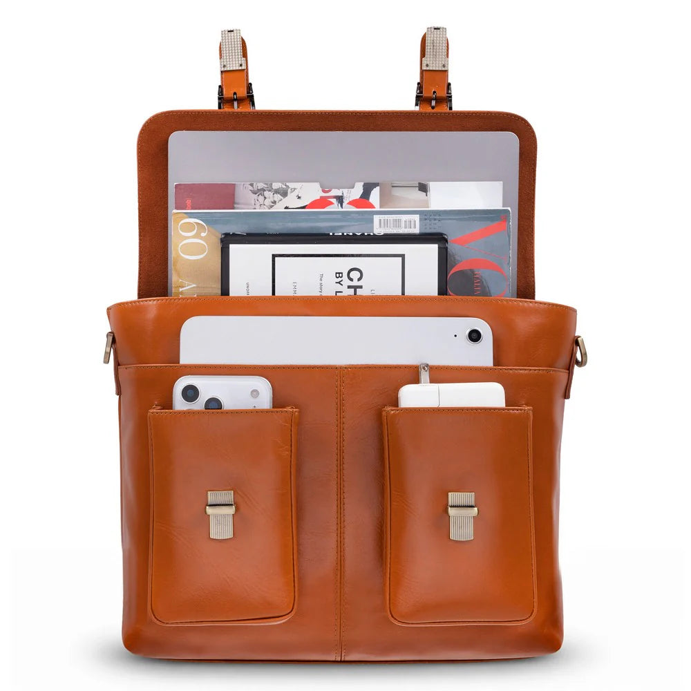 A brown leather laptop bag shown open, filled with magazines, a tablet, and two smartphones in front pockets, on a white background.