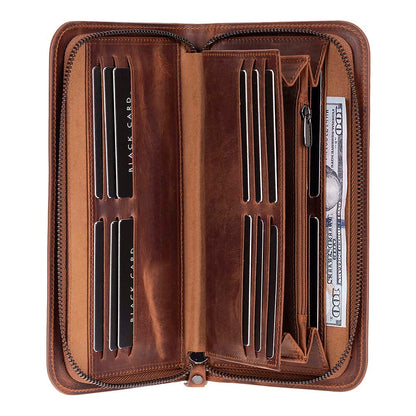 An open brown leather zip-around wallet with multiple card slots, bill compartments, and a pen loop, shown on a plain white background.