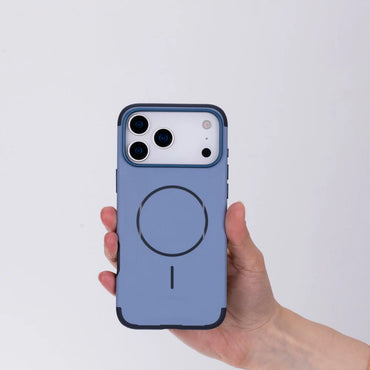 Hand holding a blue phone case with a white background