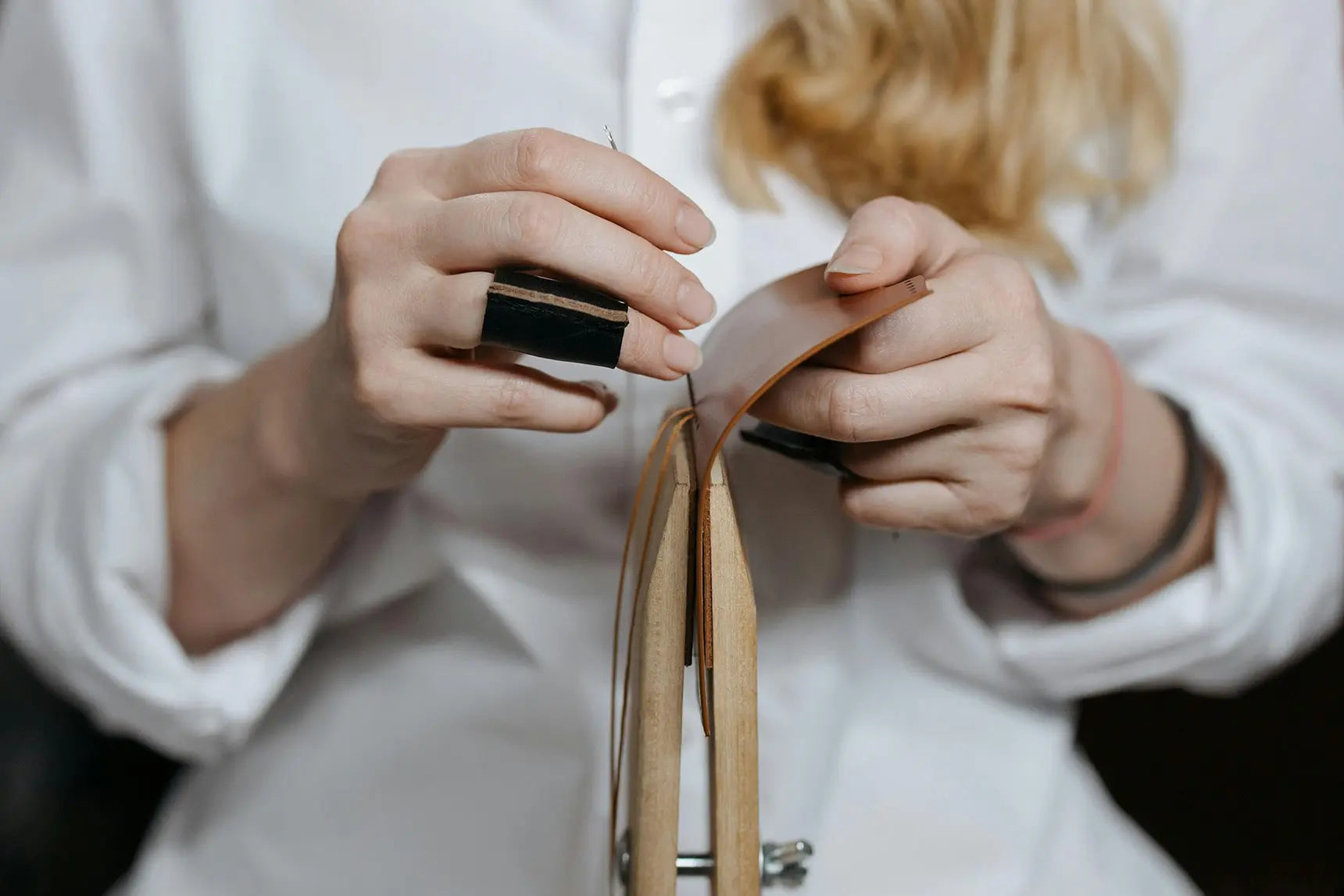 Load video: Luxara Crafts artisan hand-stitching premium leather goods in Istanbul workshop.